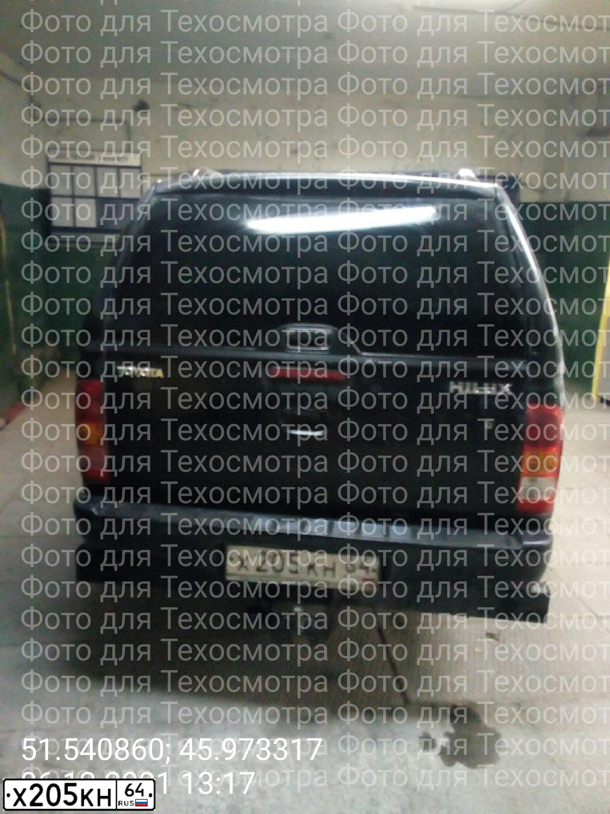 Фото автомобиля TOYOTA HILUX, 2010 — госномер Х205КН64. Цвет: ЧЕРНЫЙ