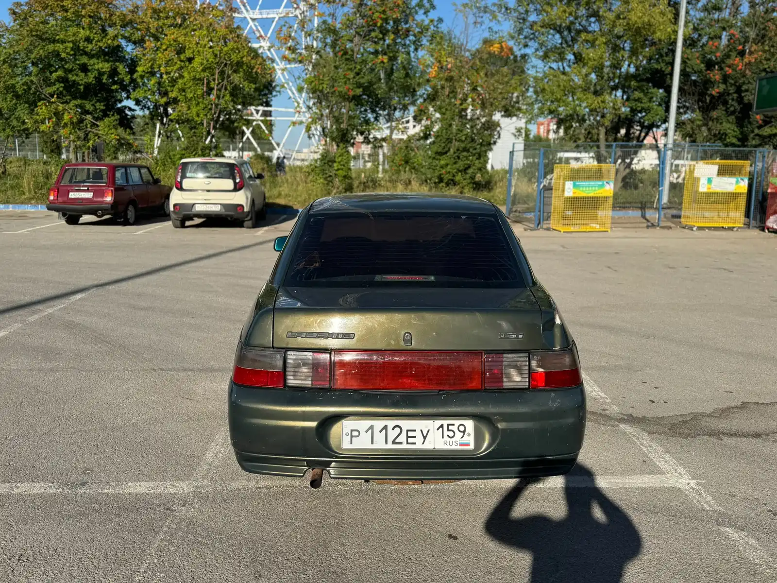 Фото автомобиля LADA 2110 LADA, 2004 — госномер Р112ЕУ159. Цвет: ЗОЛОТИСТЫЙ ТЕМНО-ЗЕЛЕНЫЙ