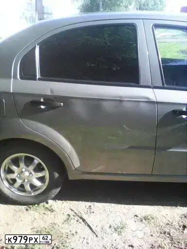 Фото автомобиля CHEVROLET AVEO, 2009 — госномер К979РХ62. Цвет: СЕРЫЙ