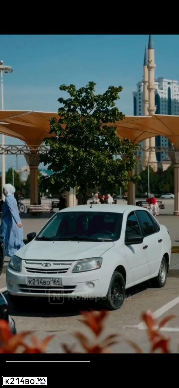 Фото автомобиля MITSUBISHI LANCER, 2006 — госномер К214ВО164. Цвет: ЧЕРНЫЙ