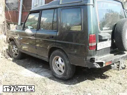 Фото автомобиля LANDROVER DISCOVERY, 1997 — госномер Т970УЕ99. Цвет: ЗЕЛЕНЫЙ
