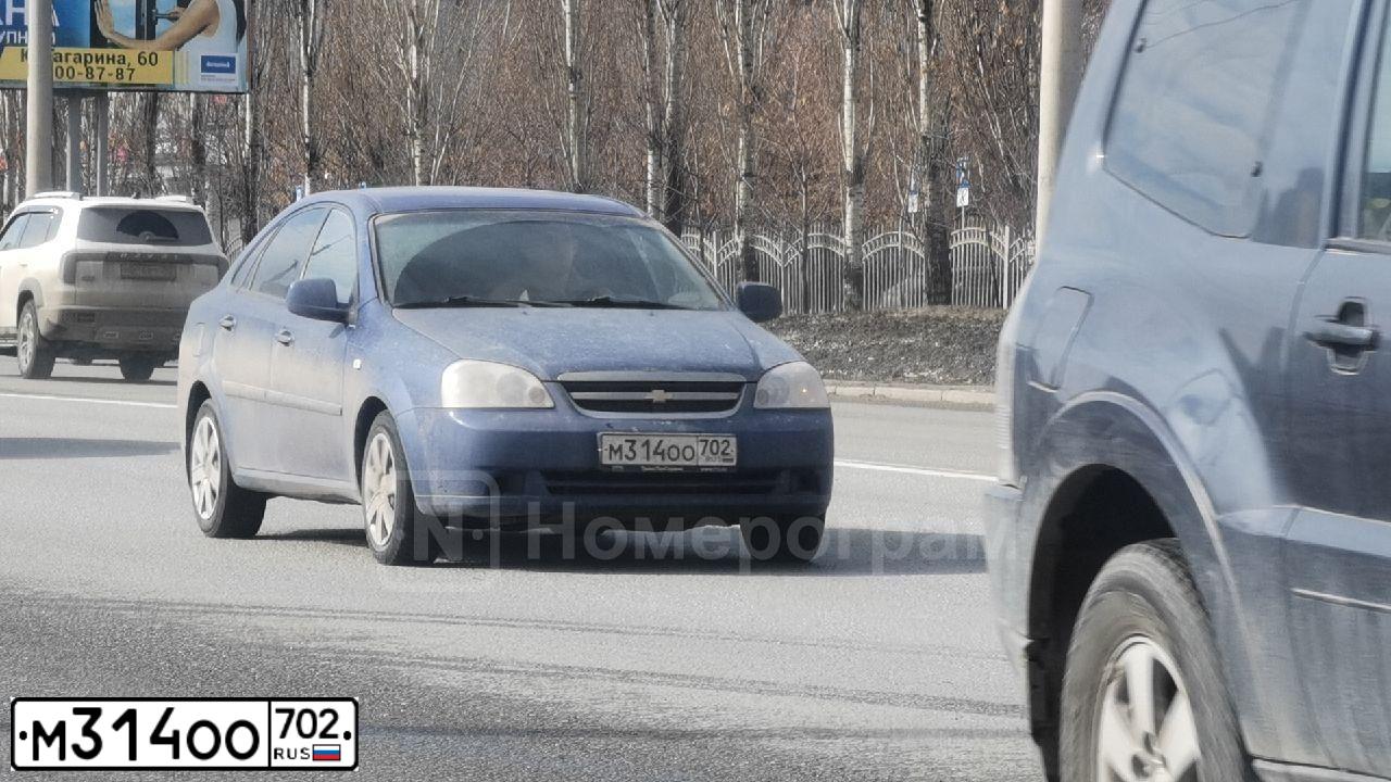 Фото автомобиля CHEVROLET LACETTI, 2010 — госномер М314ОО702. Цвет: синий