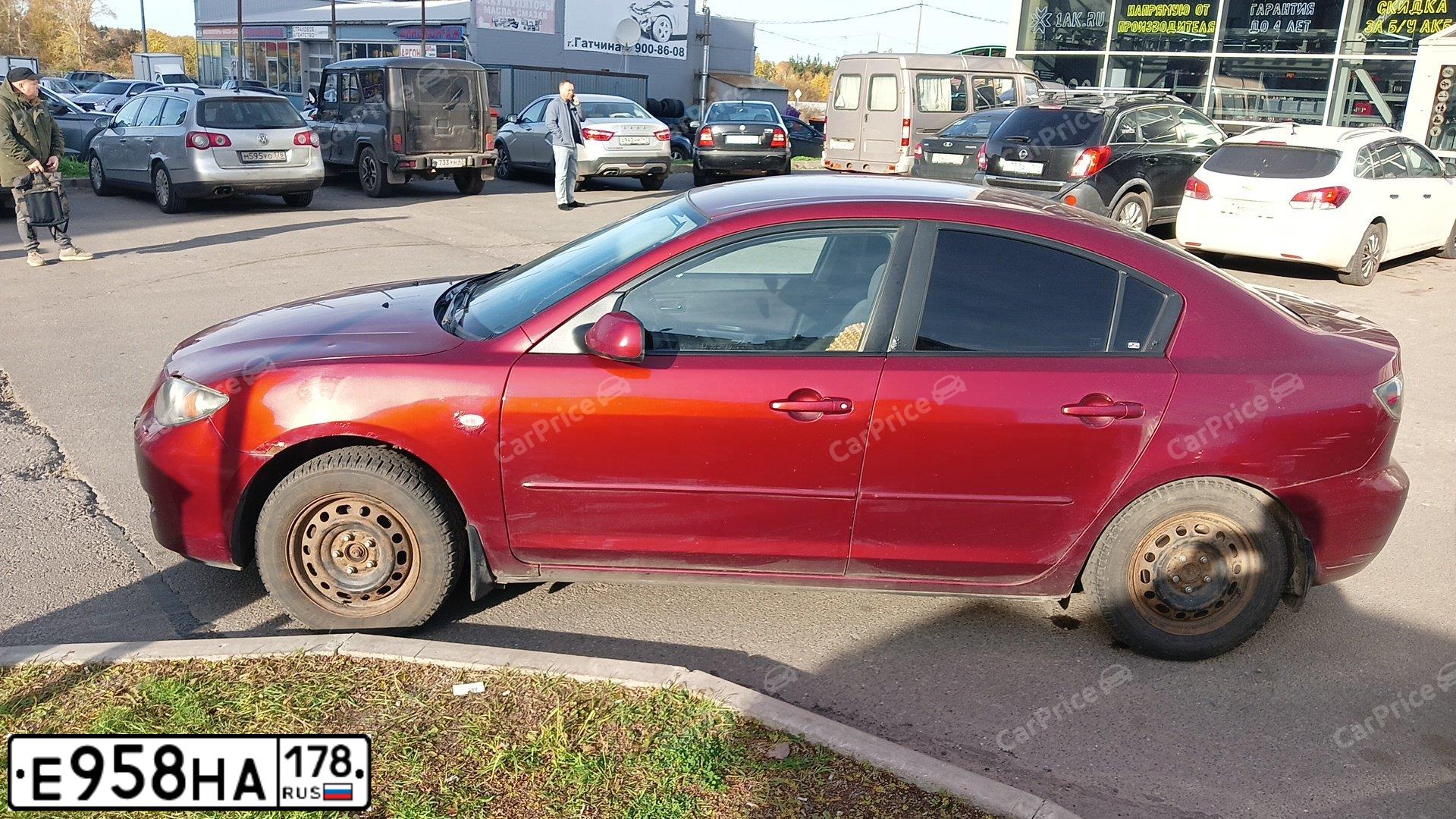 Фото автомобиля MAZDA 3, 2008 — госномер С865УР124. Цвет: Красный