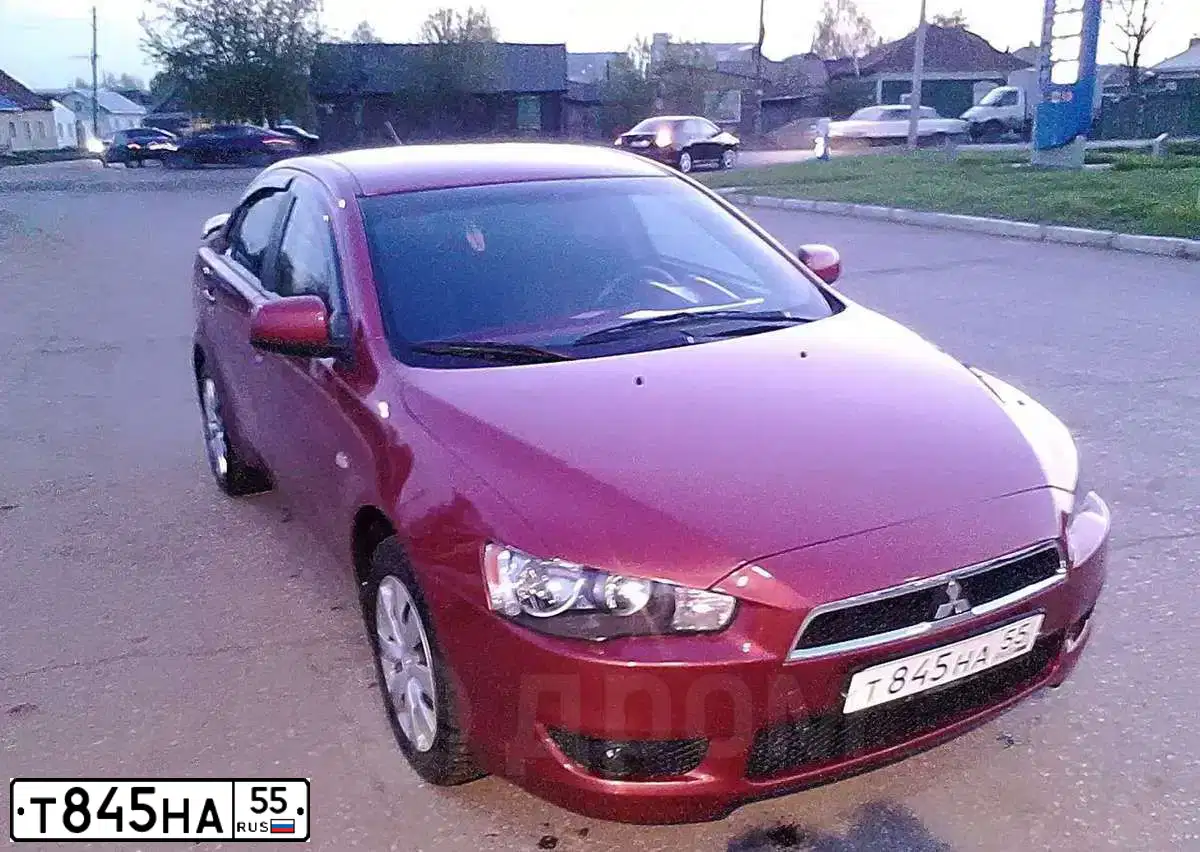 Фото автомобиля MITSUBISHI LANCER, 2008 — госномер Т706НС196. Цвет: Красный