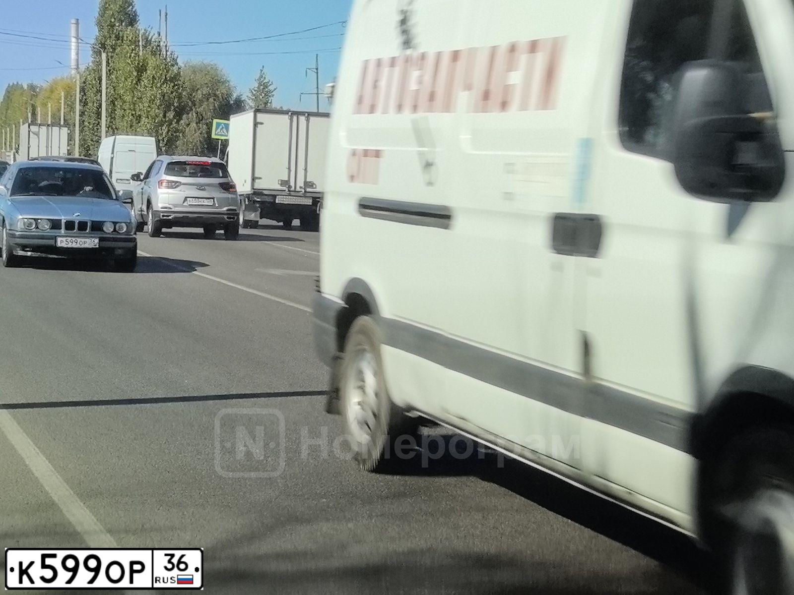 Фото автомобиля VOLKSWAGEN TIGUAN, 2011 — госномер К599ОР36. Цвет: СИНИЙ