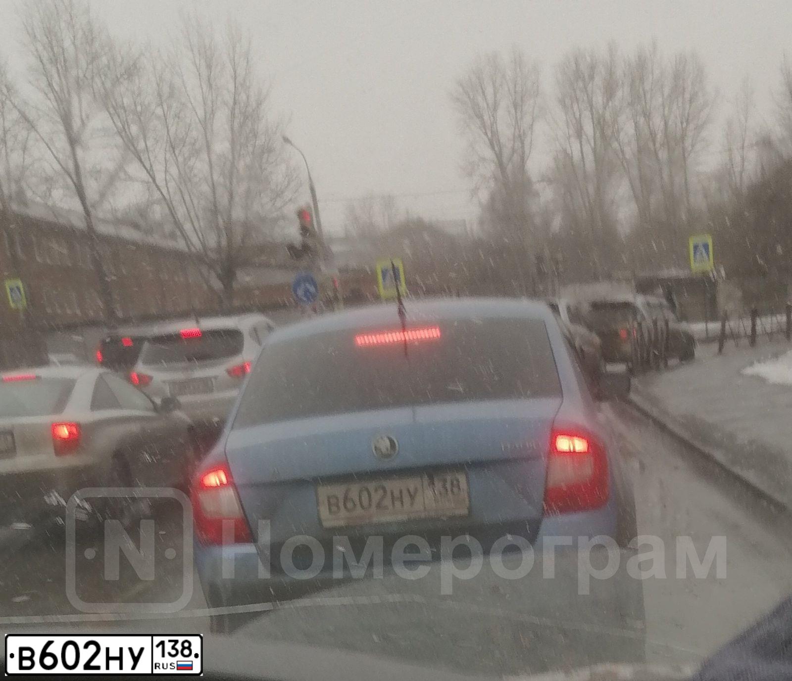 Фото автомобиля SKODA RAPID, 2014 — госномер В602НУ138. Цвет: синий
