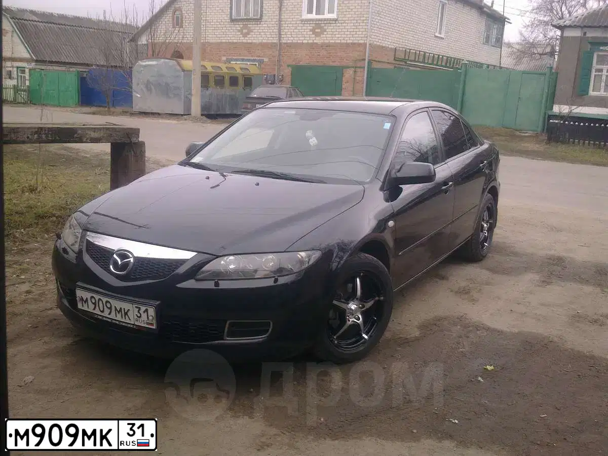 Фото автомобиля MAZDA 3, 2008 — госномер Н054УУ46. Цвет: КРАСНЫЙ