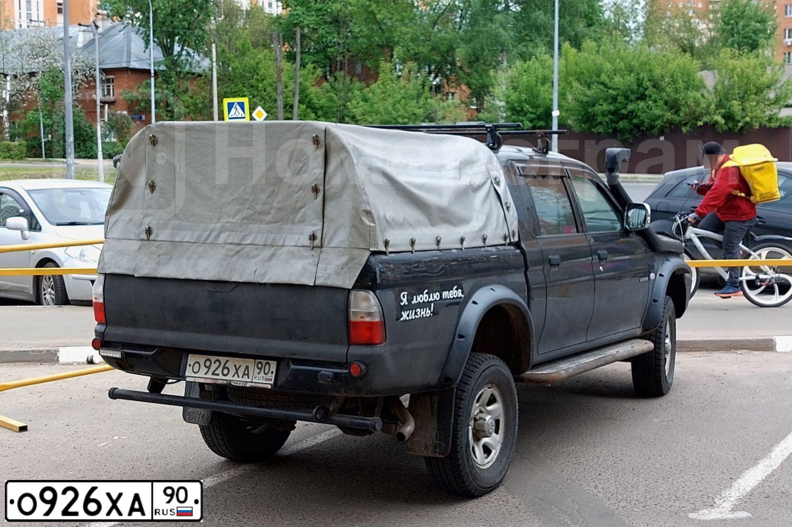 Фото автомобиля MITSUBISHI L200, 2005 — госномер О065АМ134. Цвет: ЧЕРНЫЙ