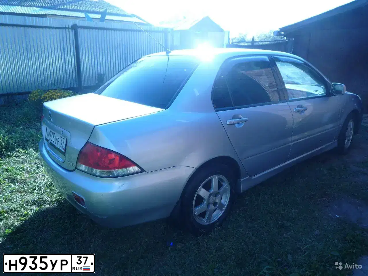 Фото автомобиля MITSUBISHI LANCER, 2004 — госномер Н935УР37. Цвет: Серебристый