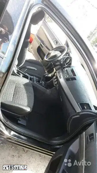 Фото автомобиля MITSUBISHI LANCER, 2012 — госномер Х185ХЕ47. Цвет: ЧЕРНЫЙ