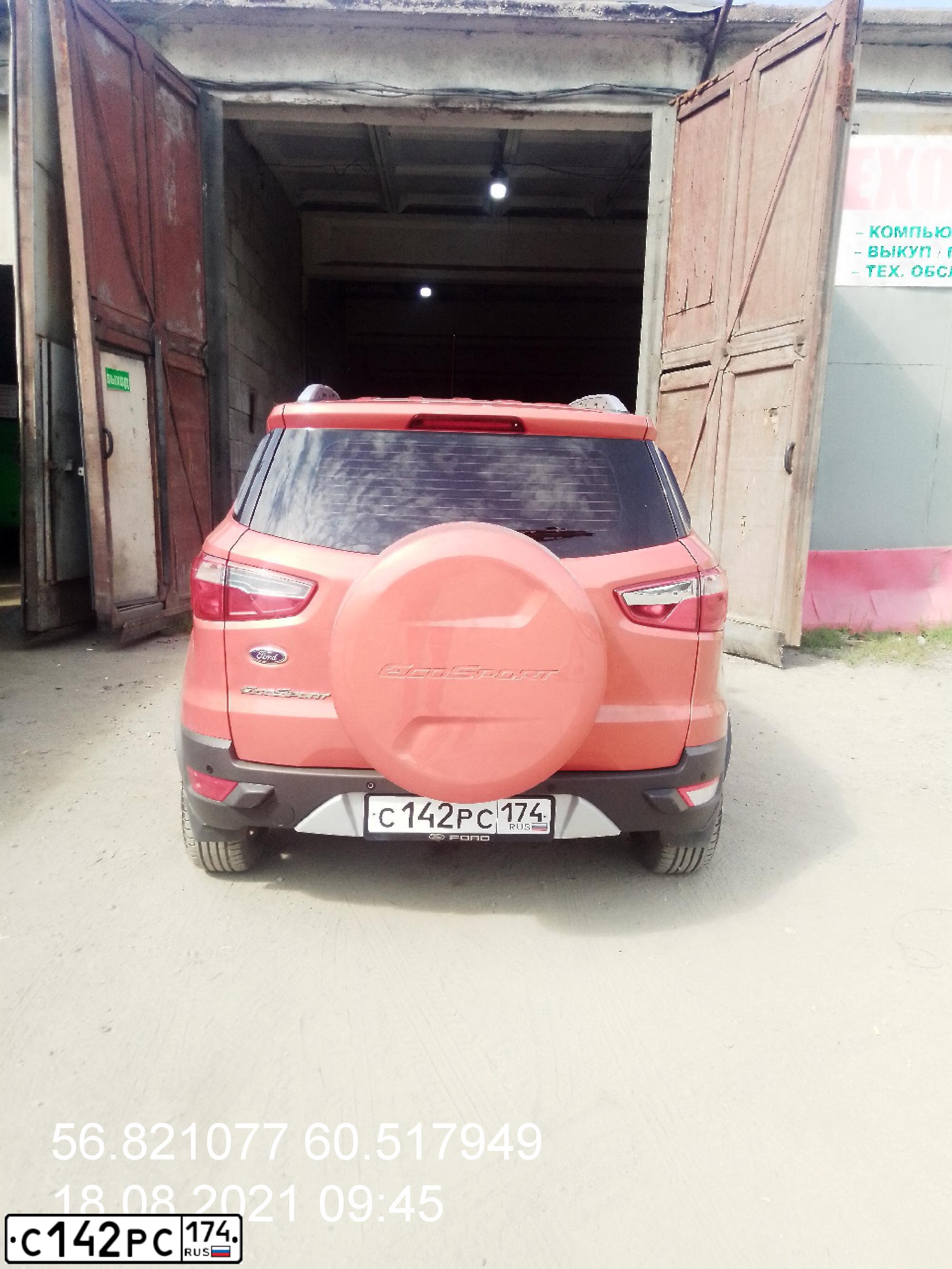 Фото автомобиля FORD ECOSPORT, 2016 — госномер С142РС174. Цвет: ОРАНЖЕВО-КРАСНЫЙ