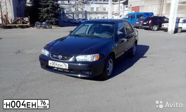 Фото автомобиля TOYOTA COROLLA, 2000 — госномер Н004ЕН76. Цвет: ЧЕРНЫЙ