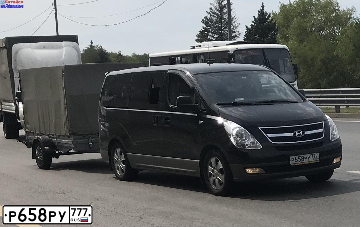 Фото автомобиля HYUNDAI GRAND STAREX, 2014 — госномер Р658РУ777. Цвет: ЧЕРНЫЙ СЕРЫЙ