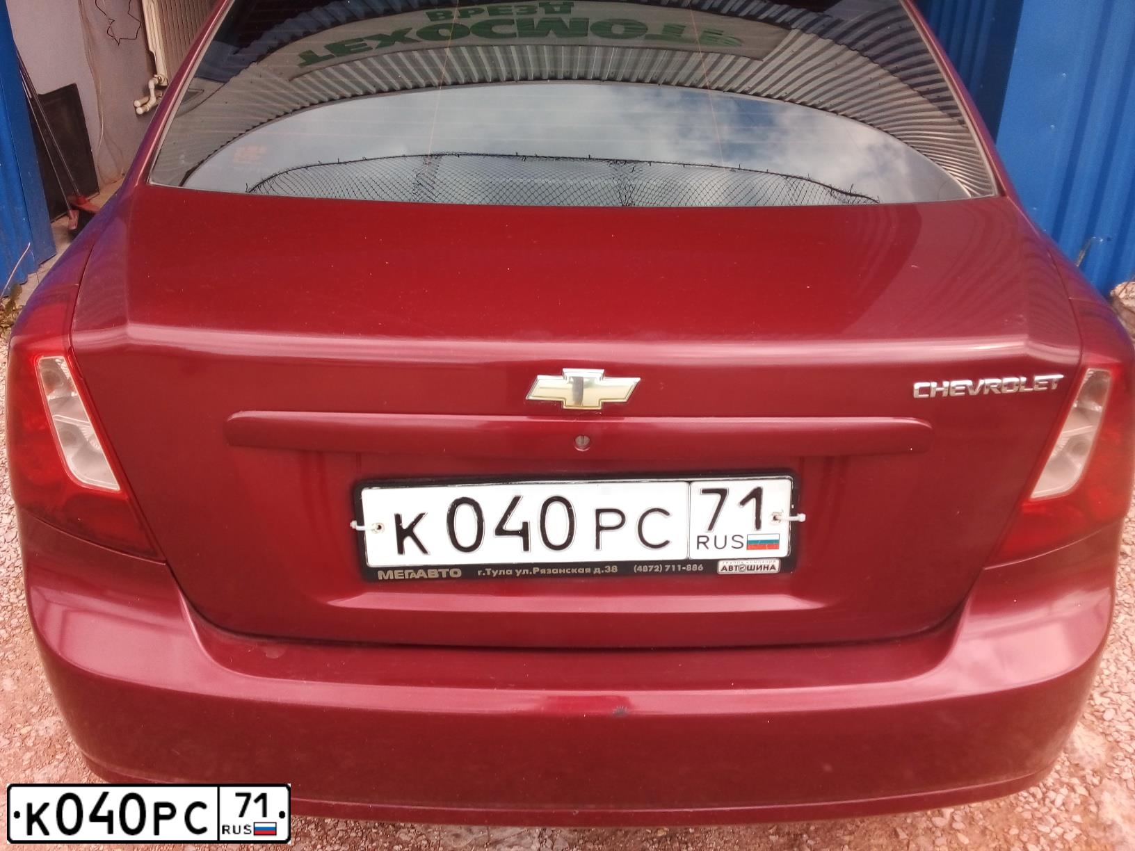 Фото автомобиля CHEVROLET LACETTI, 2004 — госномер Т234ТУ97. Цвет: Красный