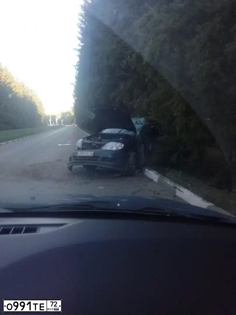 Фото автомобиля TOYOTA COROLLA, 2005 — госномер О991ТЕ72. Цвет: ТЕМНО СИНИЙ