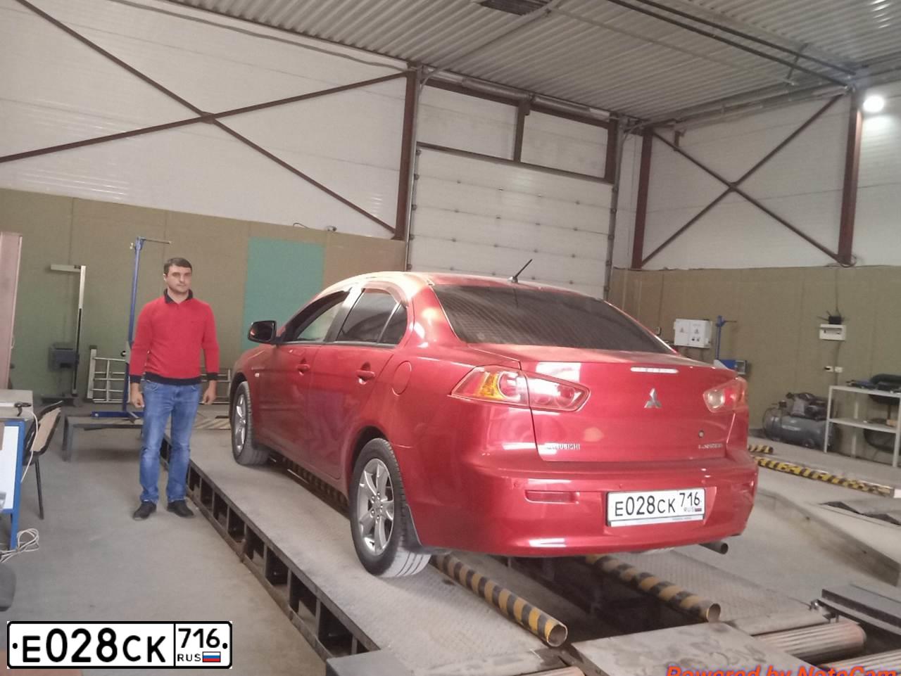 Фото автомобиля MITSUBISHI LANCER, 2008 — госномер М093ОМ154. Цвет: Красный