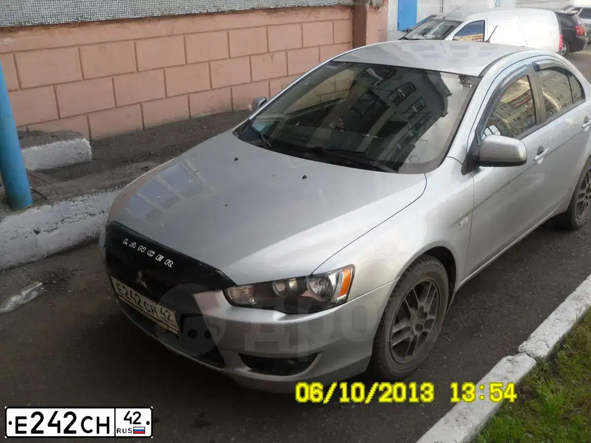 Фото автомобиля MITSUBISHI LANCER, 2007 — госномер С700УС154. Цвет: СЕРЕБРИСТЫЙ