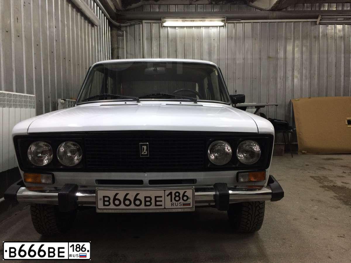 Фото автомобиля BMW SERIE 3, 2012 — госномер В666ВЕ186. Цвет: Коричневый