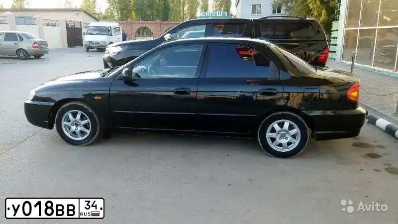 Фото автомобиля KIA SPECTRA, 2007 — госномер К274ТС134. Цвет: ЧЕРНЫЙ ЖЕМЧУГ