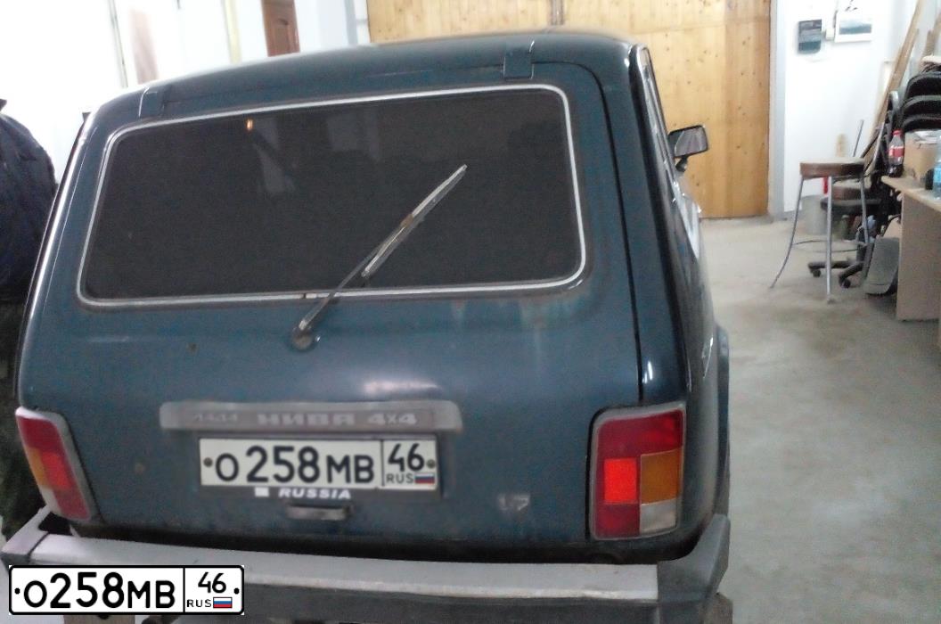 Фото автомобиля LADA 2131 NIVA, 2008 — госномер Н033ЕО29. Цвет: Темно-зеленый