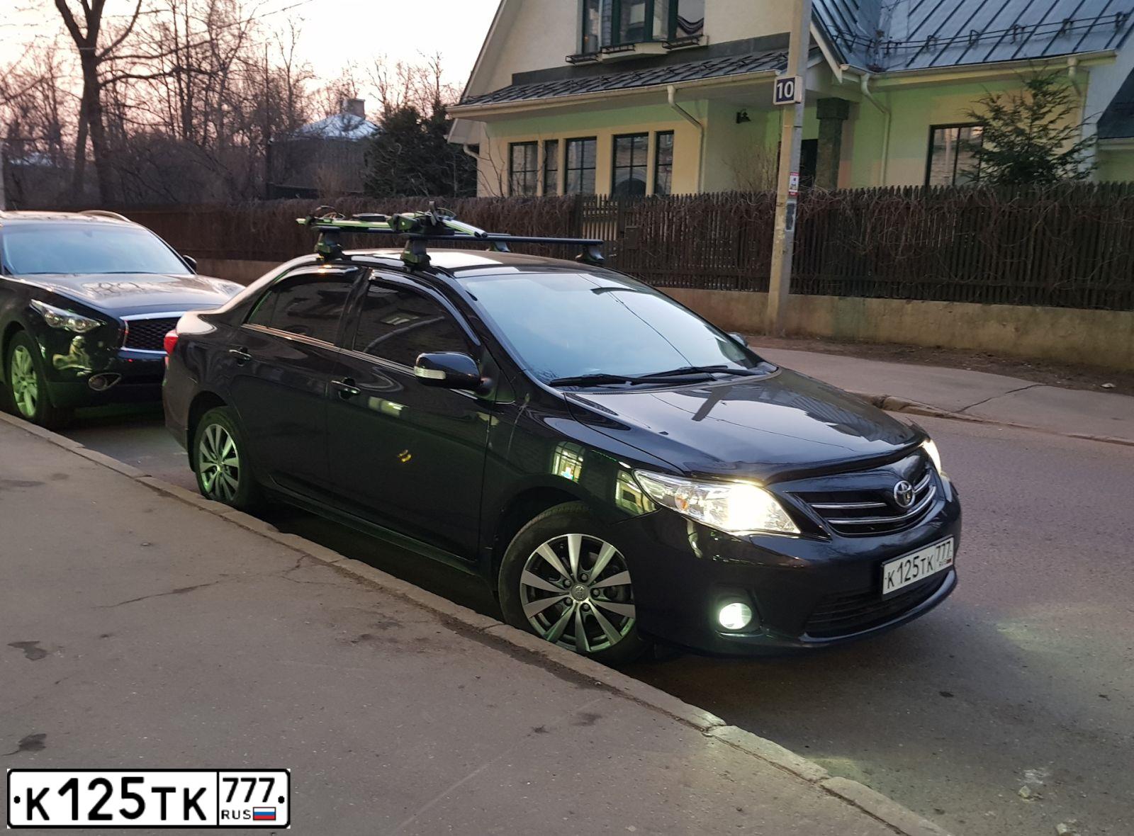 Фото автомобиля TOYOTA COROLLA, 2012 — госномер К125ТК777. Цвет: ЧЕРНЫЙ