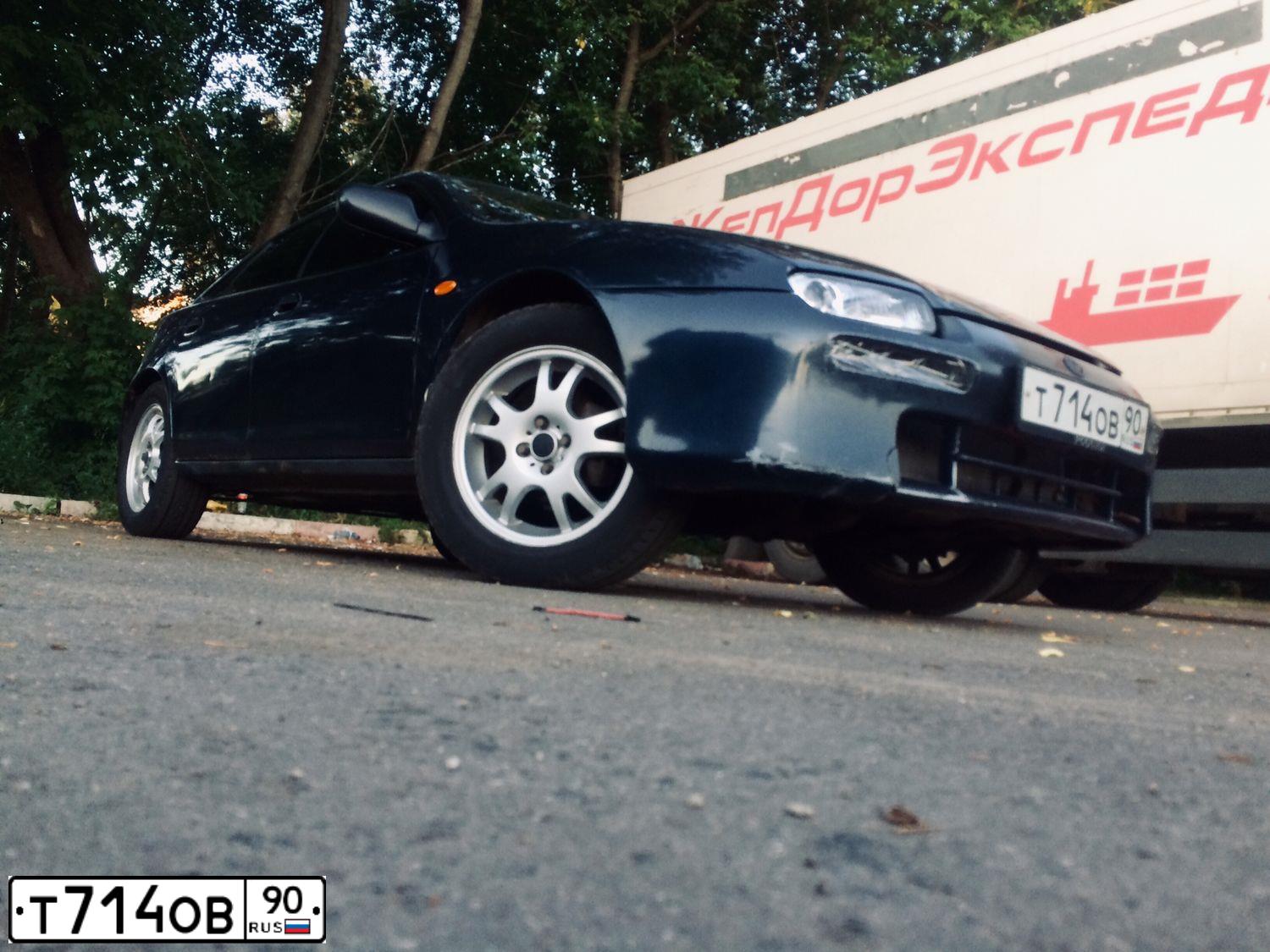 Фото автомобиля MAZDA 323, 1998 — госномер К795АС180. Цвет: синий