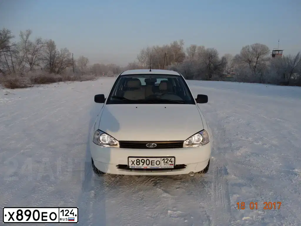 Фото автомобиля LADA KALINA, 2012 — госномер Н205МВ19. Цвет: Белый