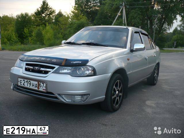 Фото автомобиля DAEWOO NEXIA, 2011 — госномер Е216НА67. Цвет: Серебристый