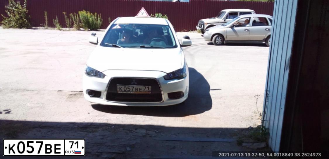 Фото автомобиля MITSUBISHI LANCER, 2012 — госномер У843НМ62. Цвет: Белый