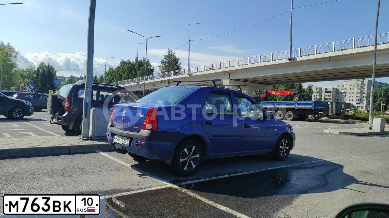 Фото автомобиля MITSUBISHI L 200, 2007 — госномер А135РВ51. Цвет: Красный