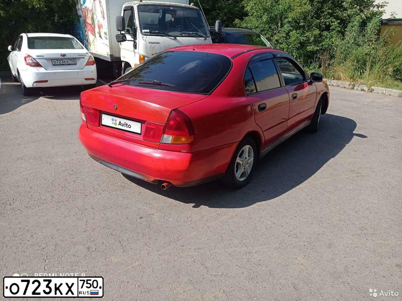 Фото автомобиля GEELY EMGRAND, 2014 — госномер О723КХ750. Цвет: БЕЛЫЙ