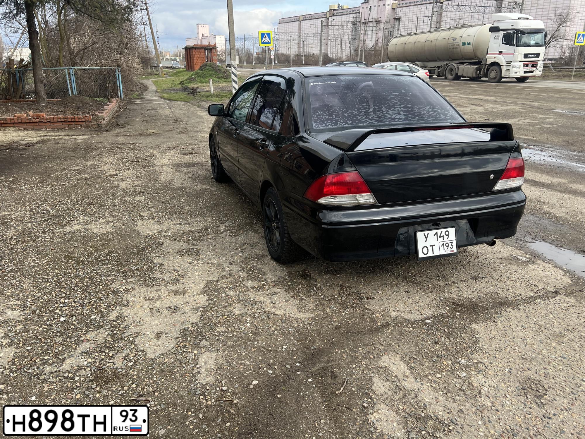 Фото автомобиля MITSUBISHI LANCER, 2002 — госномер У149ОТ193. Цвет: ЧЕРНЫЙ