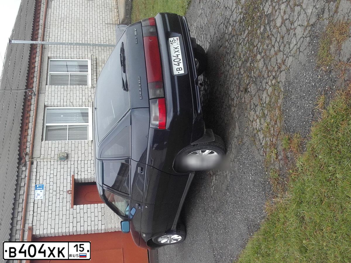 Фото автомобиля LADA 2112, 2005 — госномер В404ХК15. Цвет: ГРАФИТОВЫЙ МЕТАЛЛИК