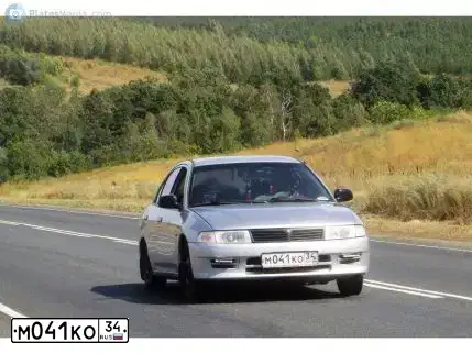 Фото автомобиля MITSUBISHI LANCER, 2000 — госномер М041КО34. Цвет: Серебристый