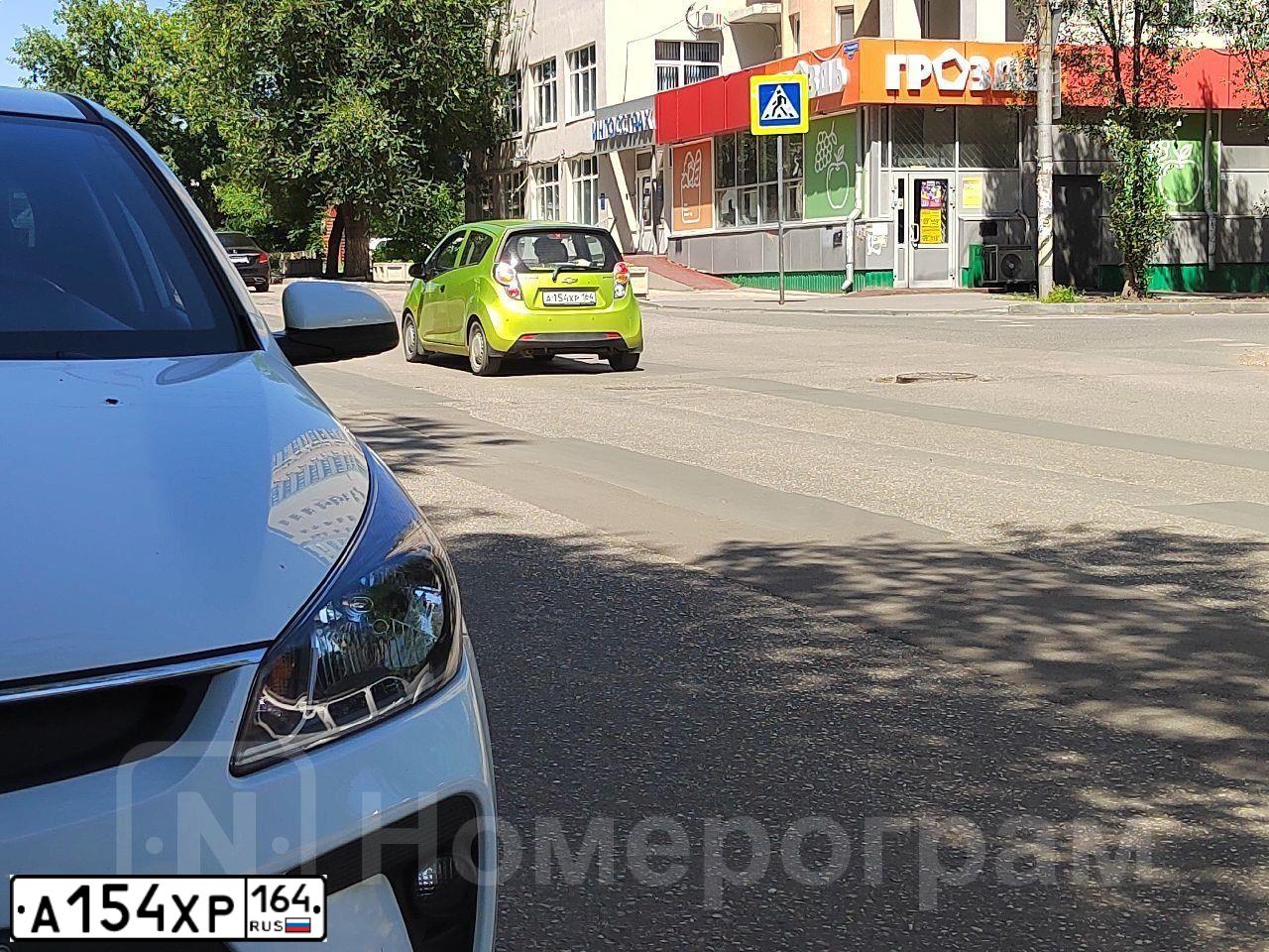 Фото автомобиля ШЕВРОЛЕ СПАРК, 2012 — госномер Е122НР164. Цвет: САЛАТОВЫЙ