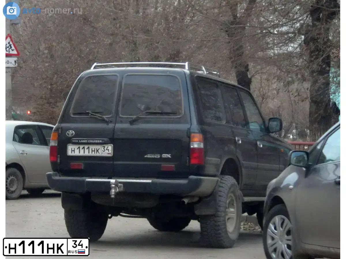Фото автомобиля BMW X5, 2010 — госномер Р002ТУ34. Цвет: СЕРЫЙ
