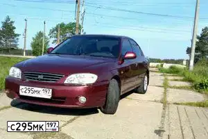 Фото автомобиля KIA SPECTRA, 2006 — госномер О987КО134. Цвет: КРАСНЫЙ ПЕРЕЦ (КРАСНЫЙ)