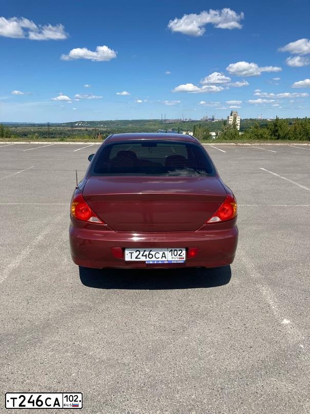 Фото автомобиля KIA SPECTRA, 2007 — госномер В560НО702. Цвет: КРАСНЫЙ ПЕРЕЦ (КРАСНЫЙ)