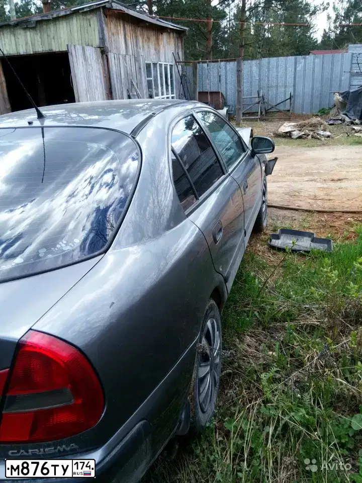 Фото автомобиля MITSUBISHI CARISMA, 2003 — госномер У039АС774. Цвет: СЕРЫЙ