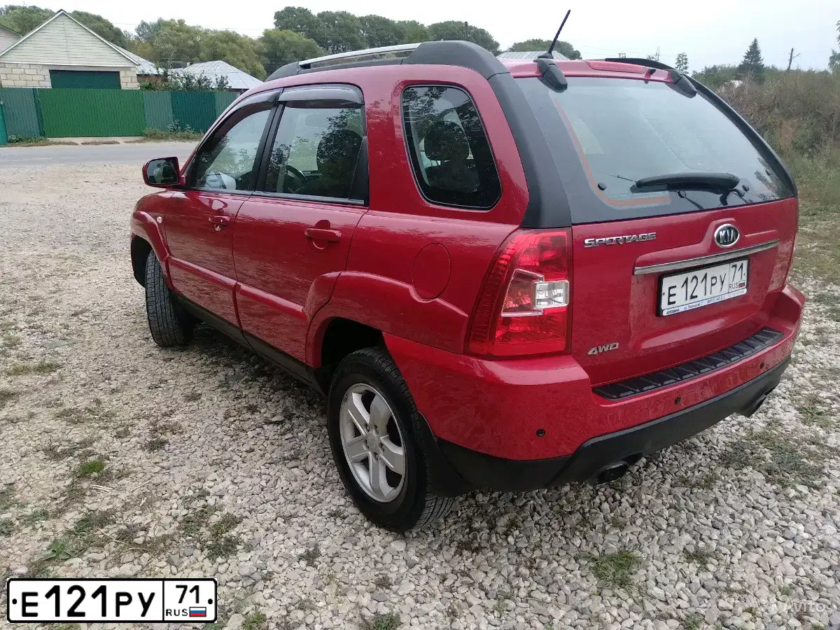 Фото автомобиля KIA SPORTAGE, 2009 — госномер Е121РУ71. Цвет: ВИШНЕВЫЙ