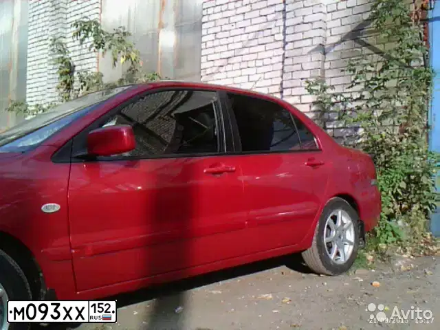 Фото автомобиля MITSUBISHI LANCER, 2005 — госномер Е303МТ152. Цвет: Красный