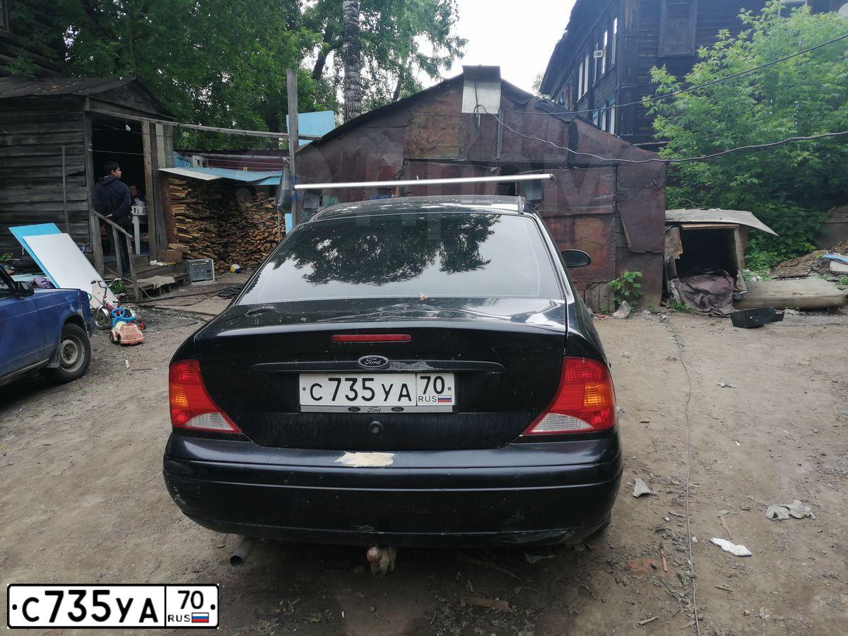 Фото автомобиля FORD FOCUS, 2002 — госномер С735УА70. Цвет: ЧЕРНЫЙ