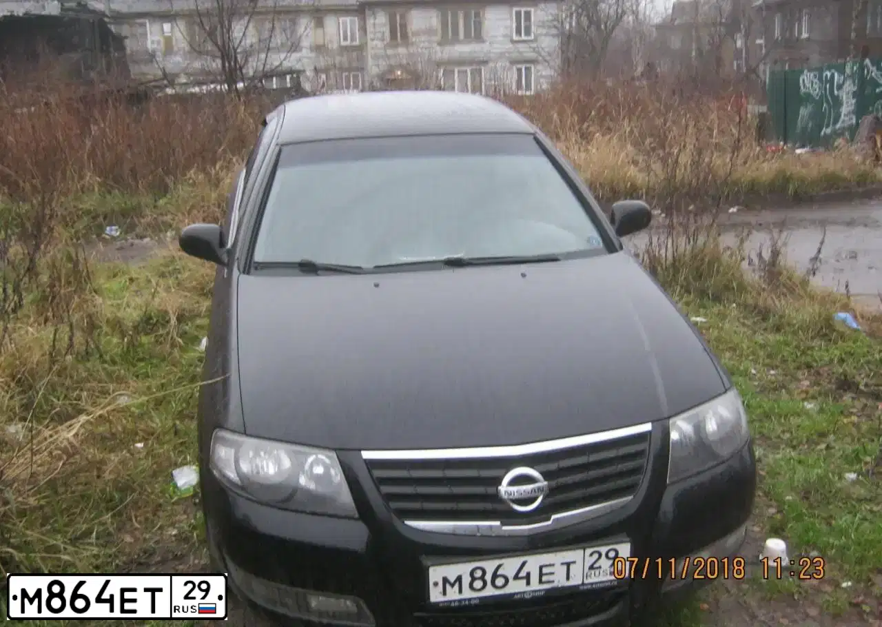 Фото автомобиля NISSAN ALMERA, 2011 — госномер О574АР29. Цвет: ЧЕРНЫЙ