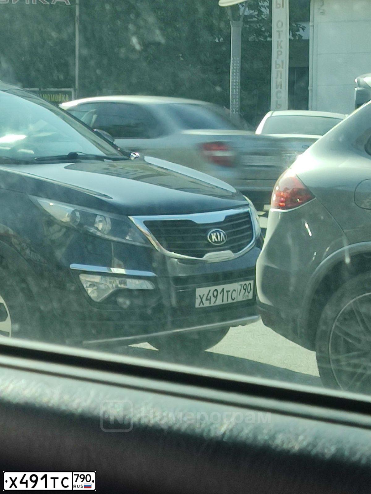 Фото автомобиля KIA SPORTAGE, 2012 — госномер Х205СВ05. Цвет: ЧЕРНЫЙ ПЕРЛАМУТР