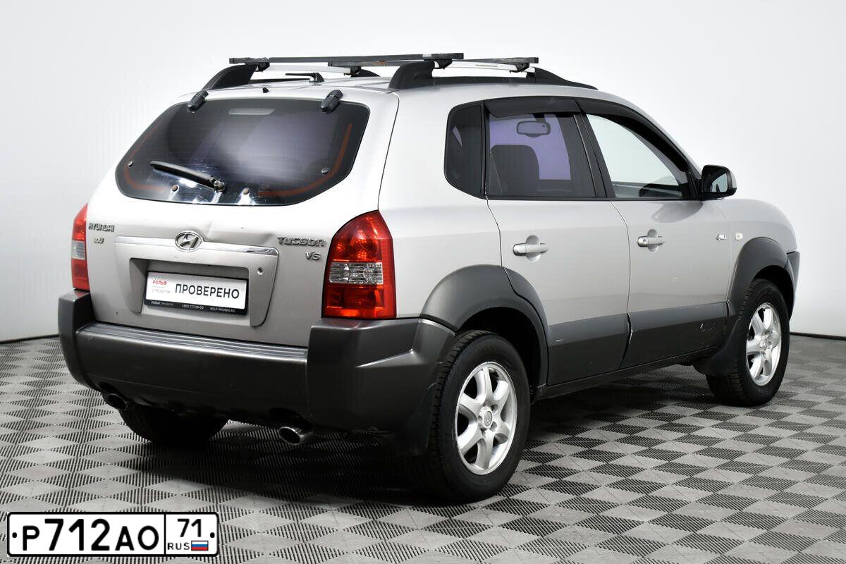 Фото автомобиля HYUNDAI TUCSON, 2004 — госномер Х163ЕН65. Цвет: Серебристый