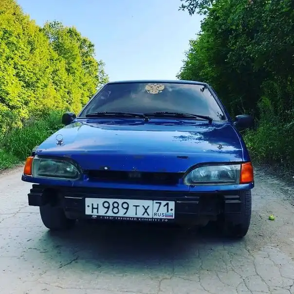Фото автомобиля LADA 2115 SAMARA, 2003 — госномер Н989ТХ71. Цвет: СЕРЕБРИСТЫЙ ЯРКО-СИНИЙ