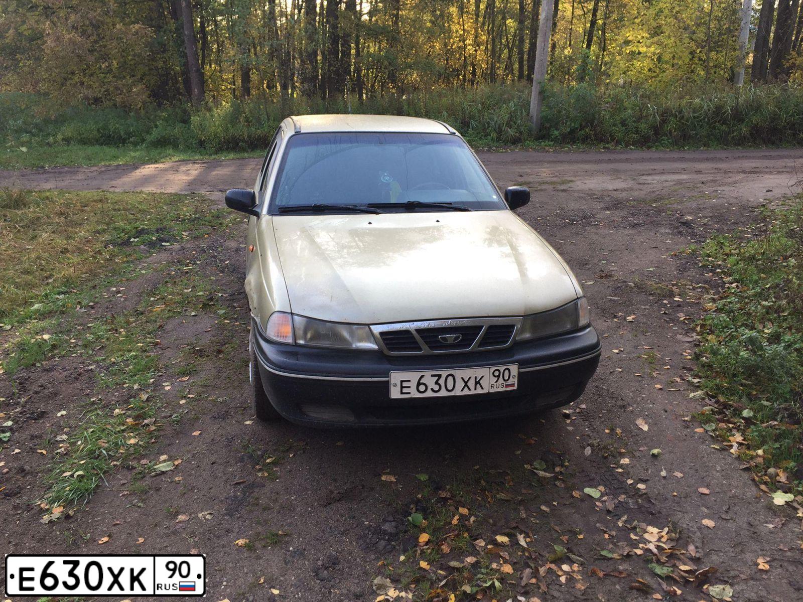 Фото автомобиля DAEWOO NEXIA, 2005 — госномер Е115ХС750. Цвет: ЖЕЛТЫЙ (ПЕСОЧНЫЙ)