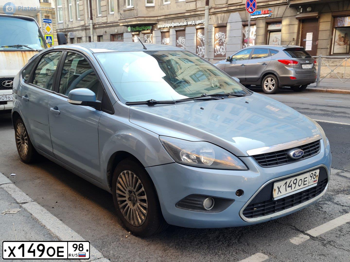 Фото автомобиля FORD FOCUS, 2008 — госномер Х149ОЕ98. Цвет: СЕРО-ГОЛУБОЙ