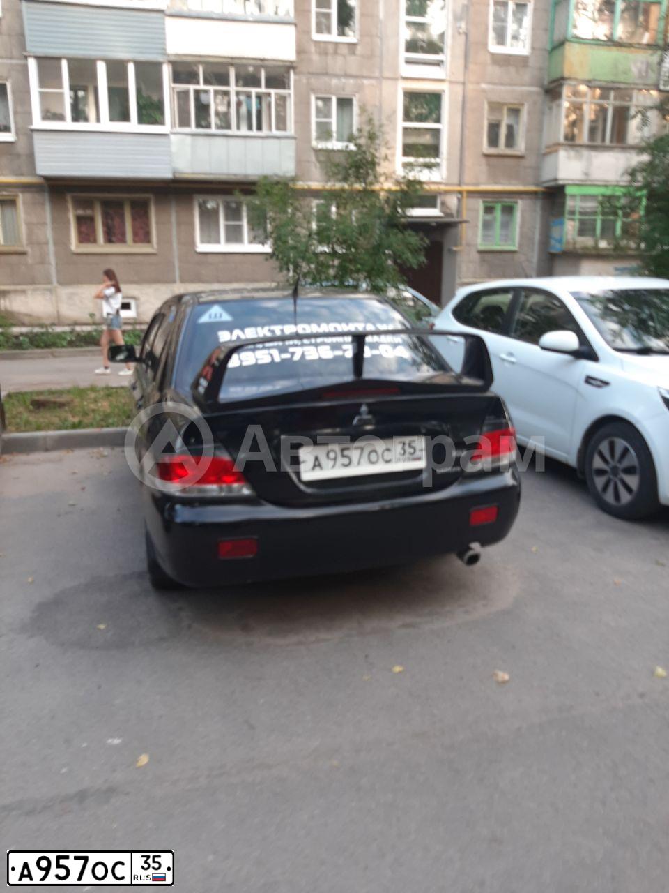 Фото автомобиля MITSUBISHI LANCER, 2005 — госномер А957ОС35. Цвет: ЧЕРНЫЙ