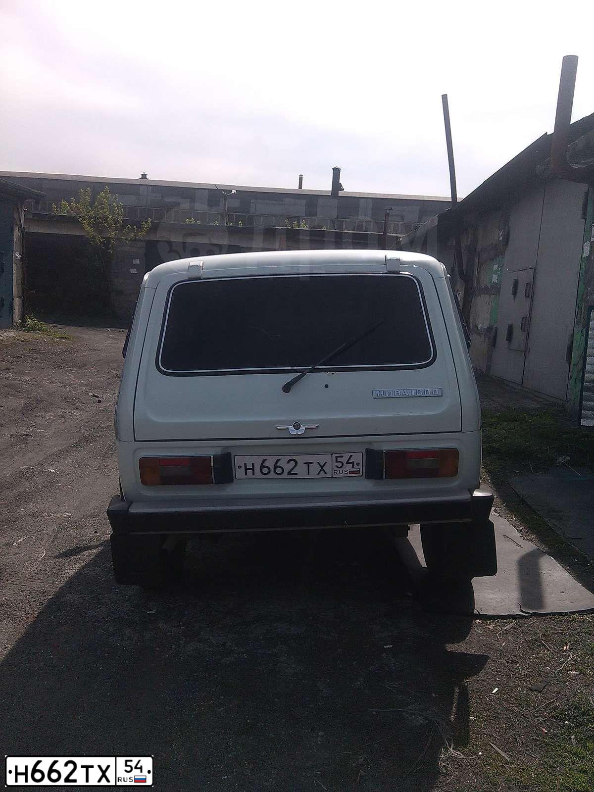 Фото автомобиля LADA 2121 NIVA, 1991 — госномер О310МВ142. Цвет: Белый
